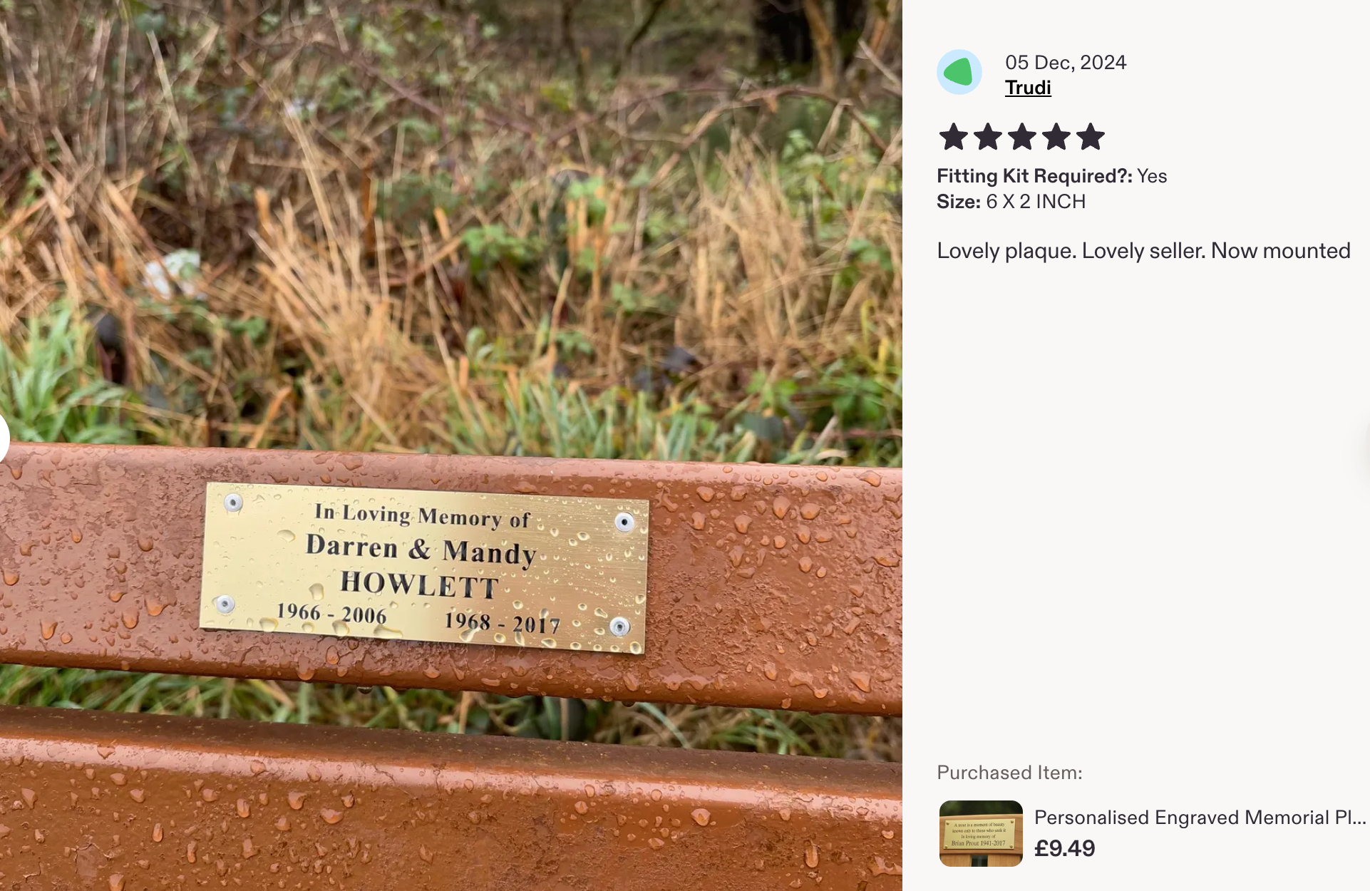 Customer photo of a brass-effect memorial plaque mounted outdoors in the rain